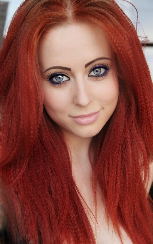 woman with red hair and blue eyes