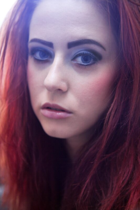 woman with red hair and blue eyes