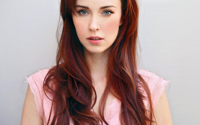 woman with red hair and blue eyes