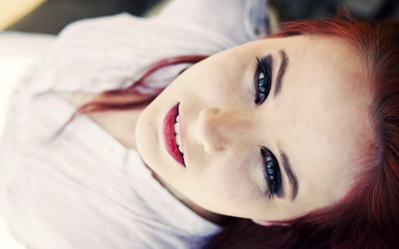 woman with red hair and blue eyes