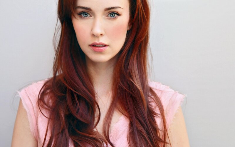 woman with red hair and blue eyes