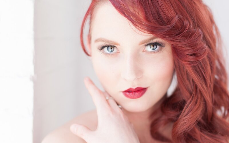 woman with red hair and blue eyes