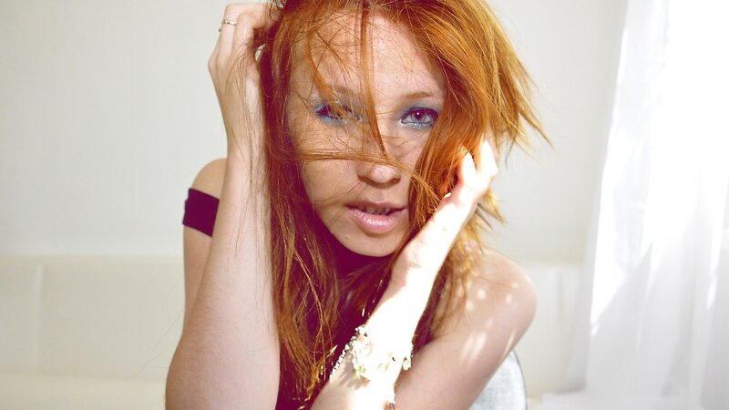 woman with red hair and blue eyes