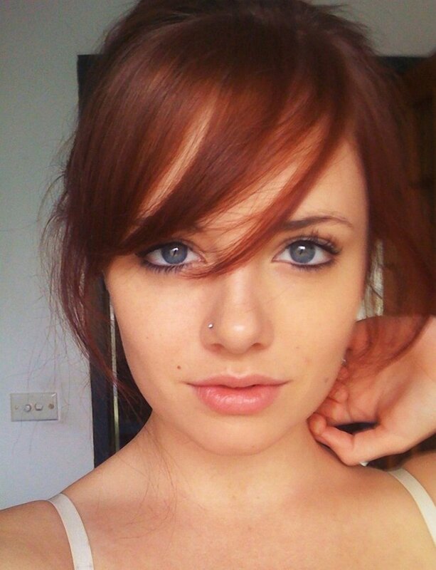 woman with red hair and blue eyes