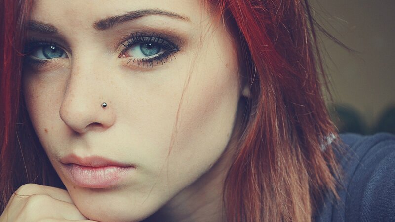 woman with red hair and blue eyes
