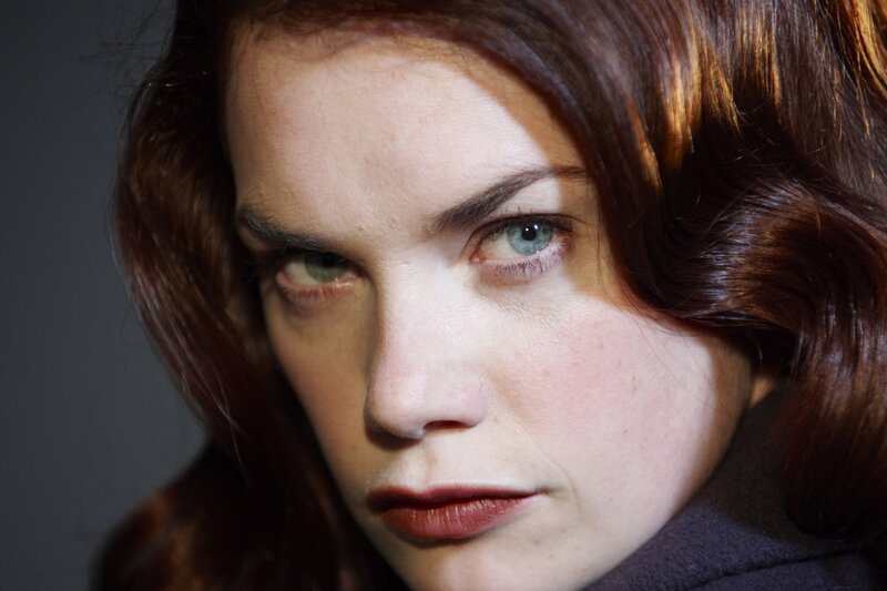 woman with red hair and blue eyes