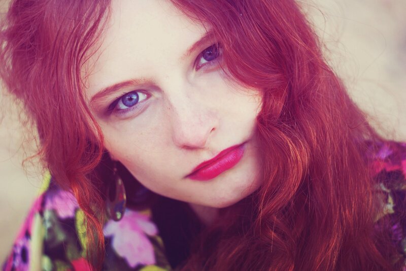 woman with red hair and blue eyes