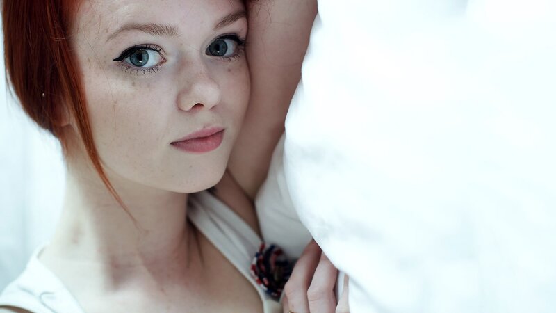 woman with red hair and blue eyes