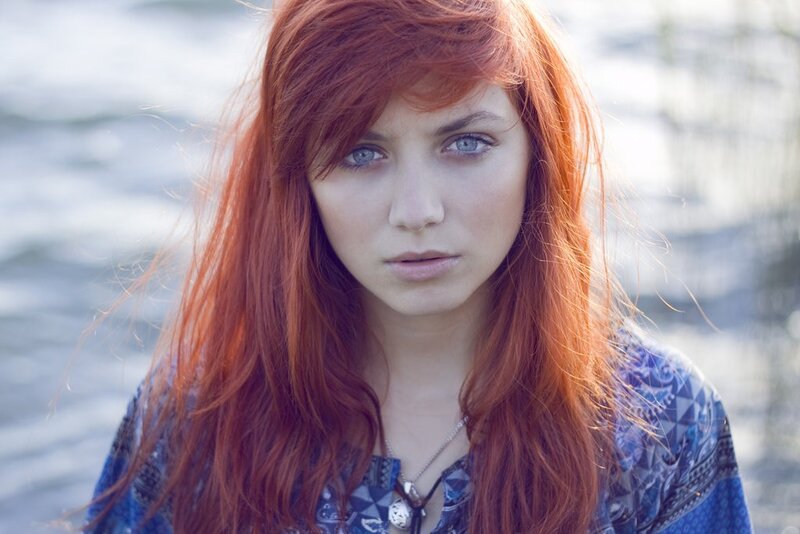 woman with red hair and blue eyes