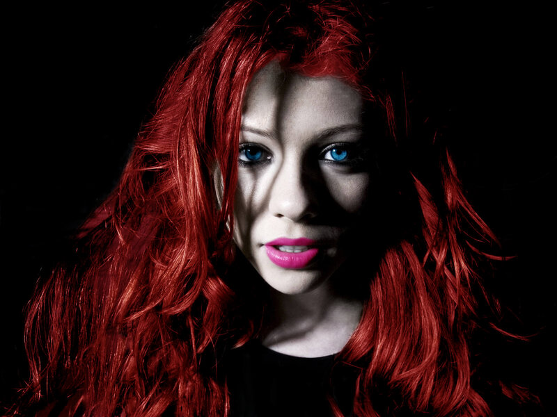 woman with red hair and blue eyes