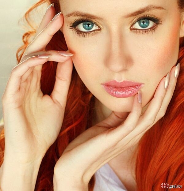 woman with red hair and blue eyes