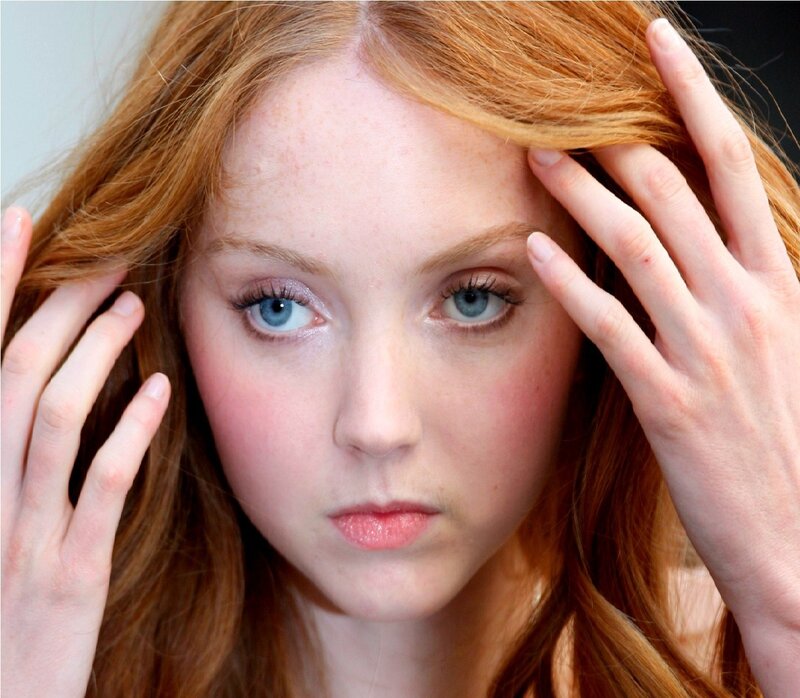 woman with red hair and blue eyes