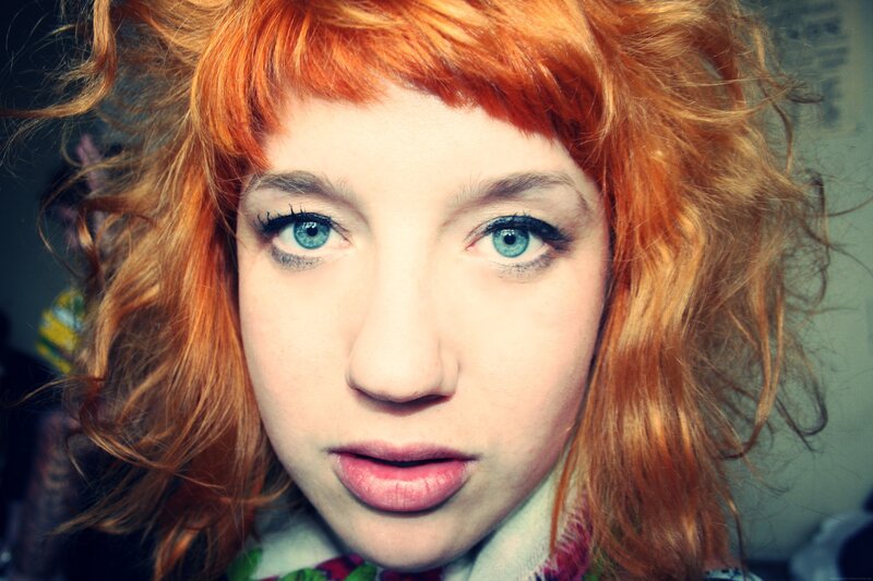 woman with red hair and blue eyes
