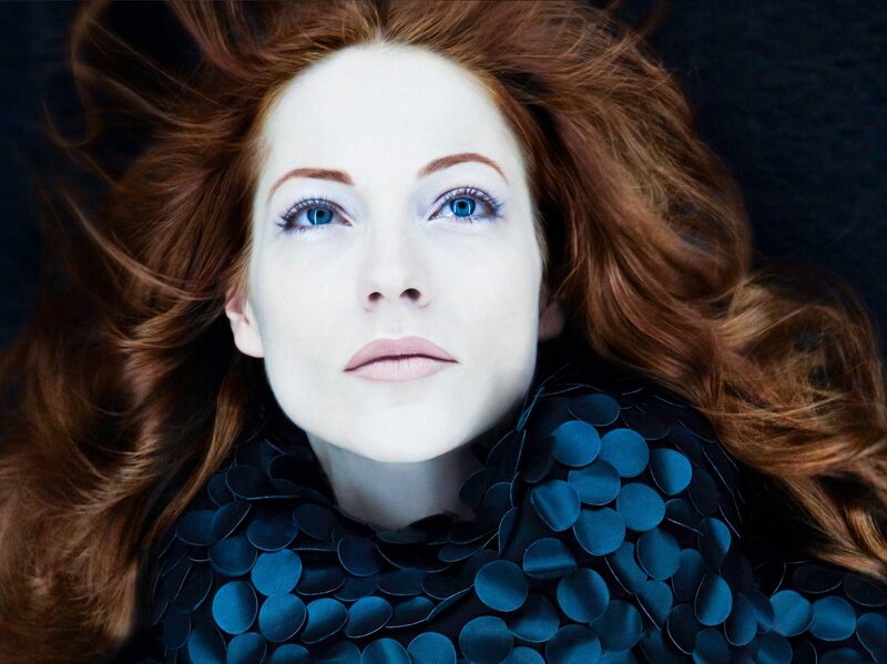 woman with red hair and blue eyes