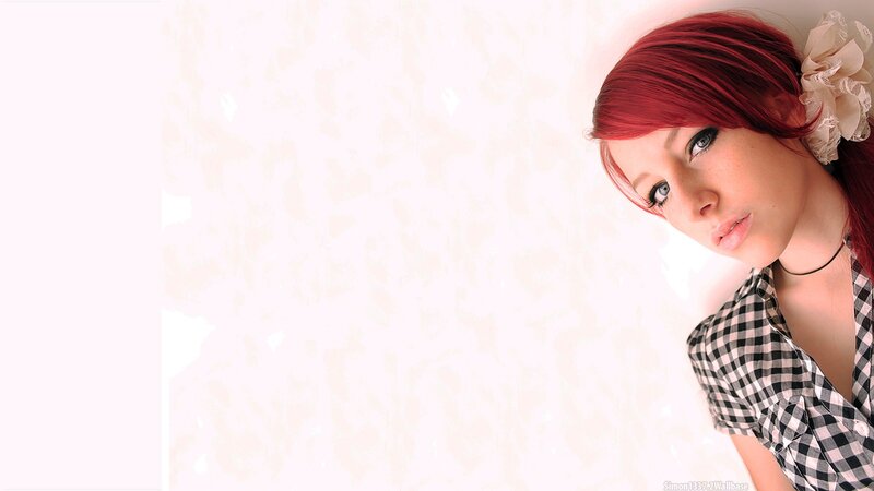woman with red hair and checkered shirt