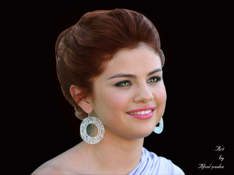woman with red hair and earrings