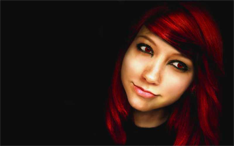 woman with red hair and eyes