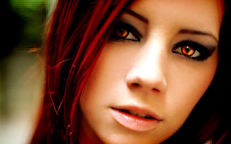 woman with red hair and eyes