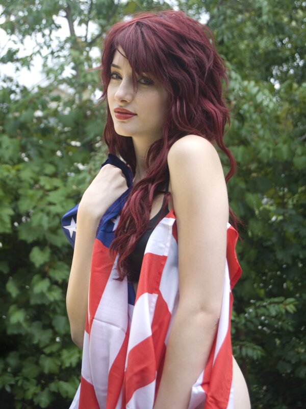 Woman with red hair and flag