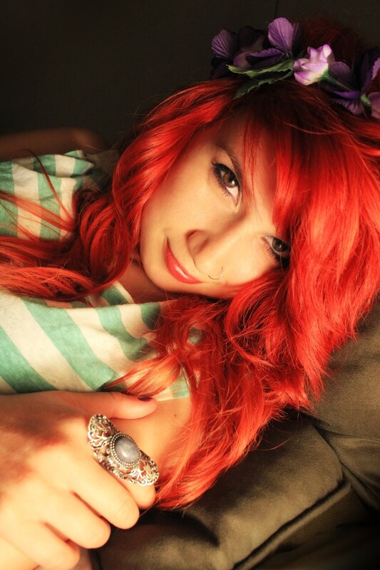 woman with red hair and flower crown