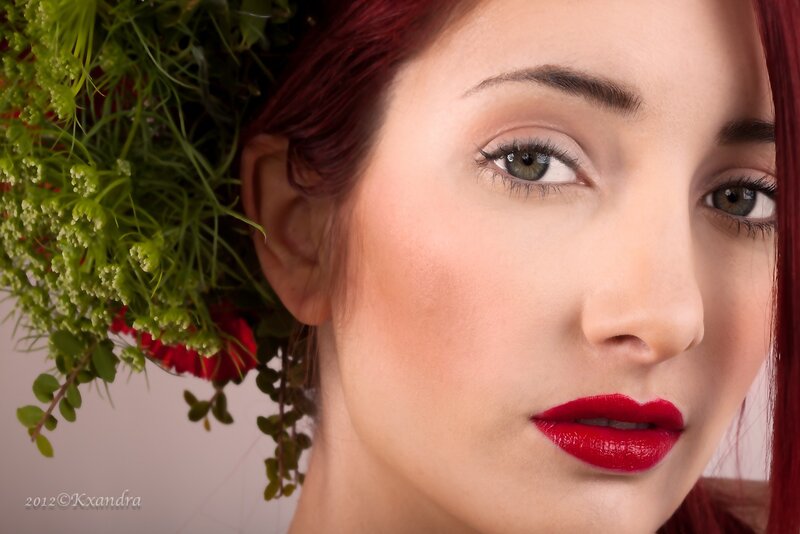 woman with red hair and flowers