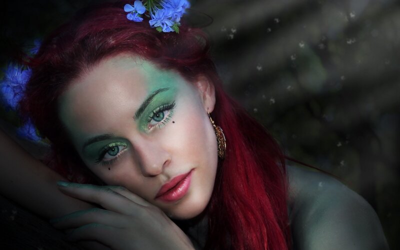 woman with red hair and flowers