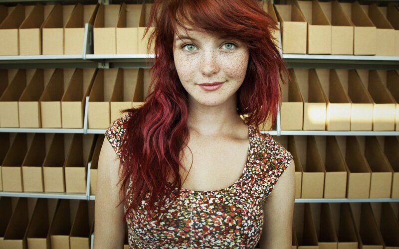 woman with red hair and freckles