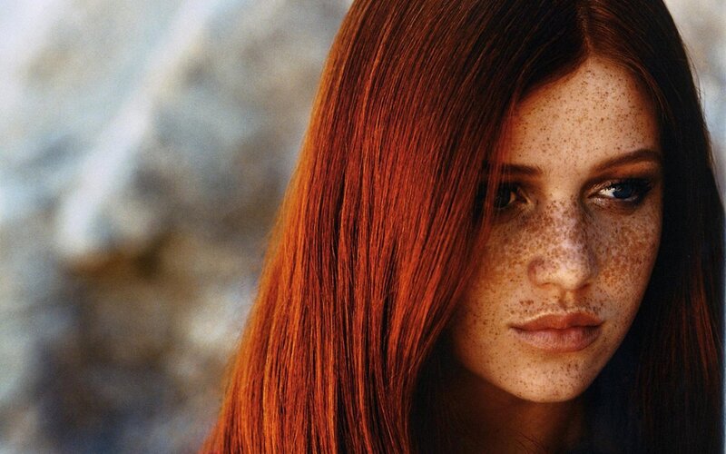 woman with red hair and freckles