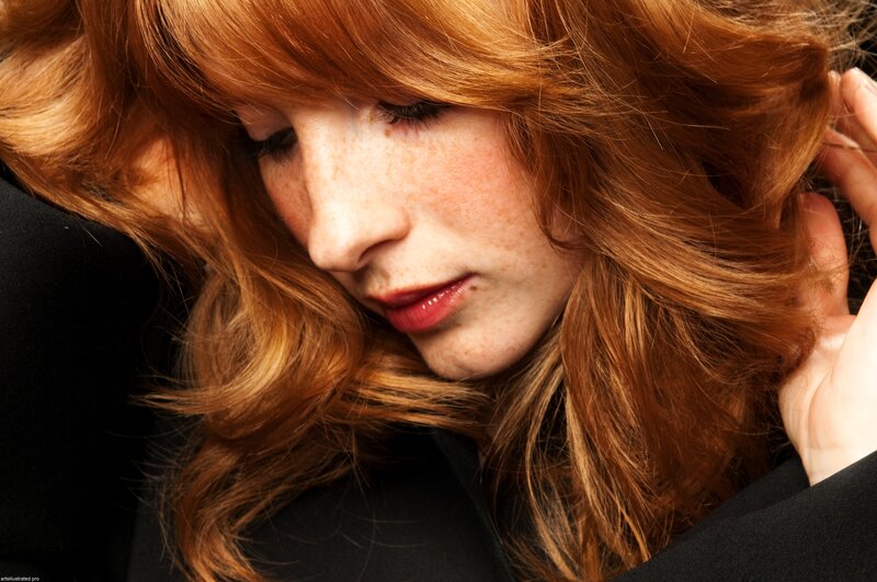 woman with red hair and freckles