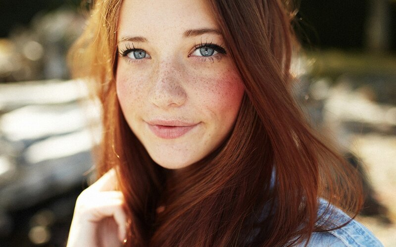 woman with red hair and freckles