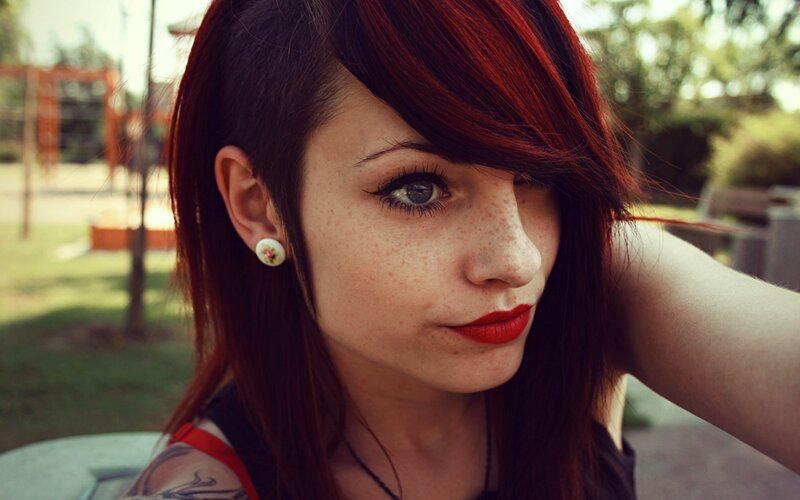 woman with red hair and freckles