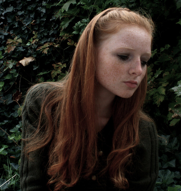 woman with red hair and freckles