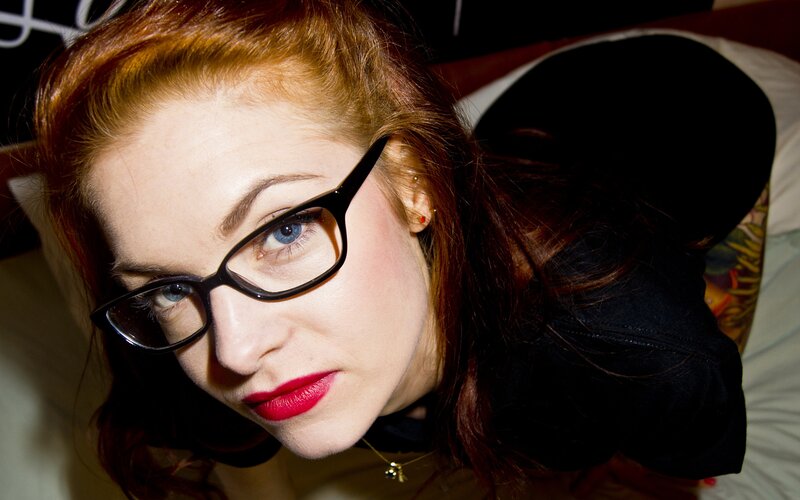 Woman with Red Hair and Glasses — Dramatic