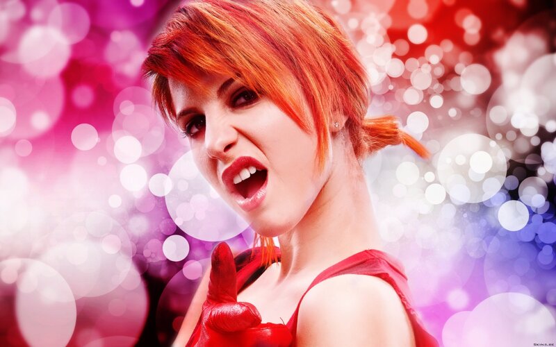 woman with red hair and gloves