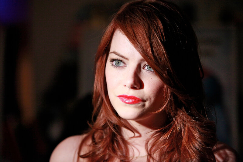woman with red hair and green eyes
