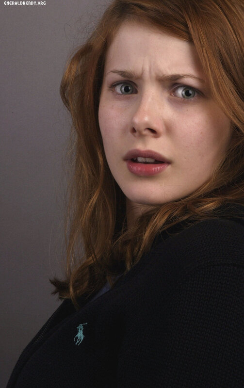 woman with red hair and green eyes