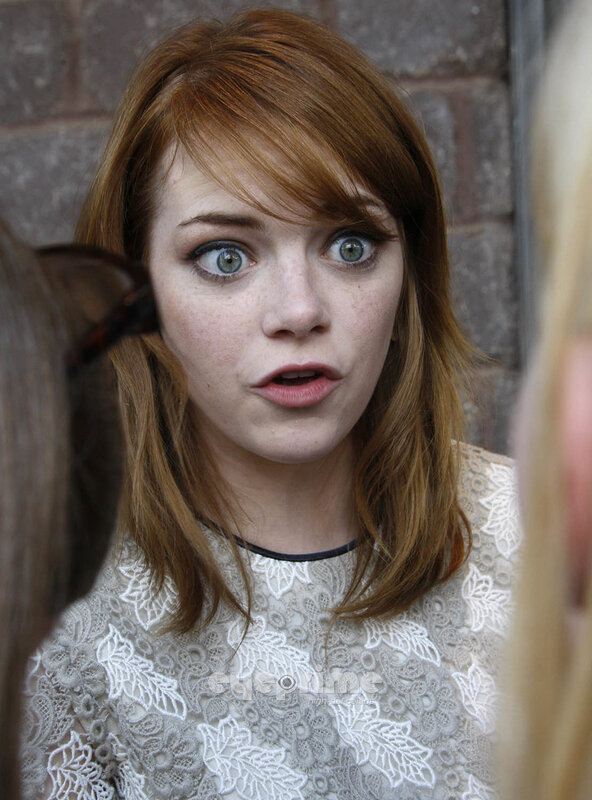 woman with red hair and green eyes