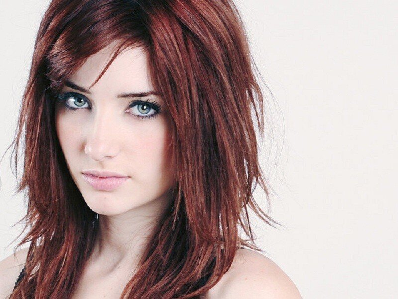 woman with red hair and green eyes