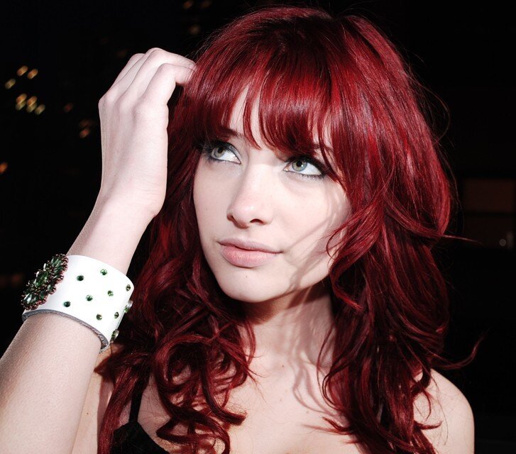 woman with red hair and green eyes