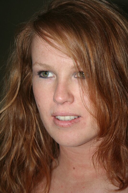 woman with red hair and green eyes
