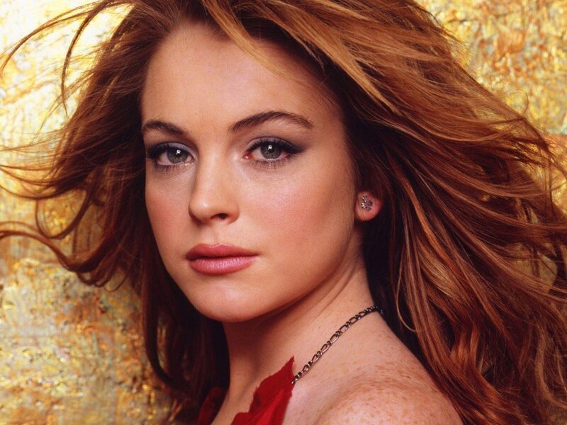 woman with red hair and green eyes