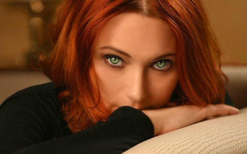 woman with red hair and green eyes