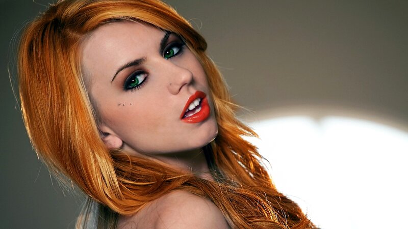 woman with red hair and green eyes