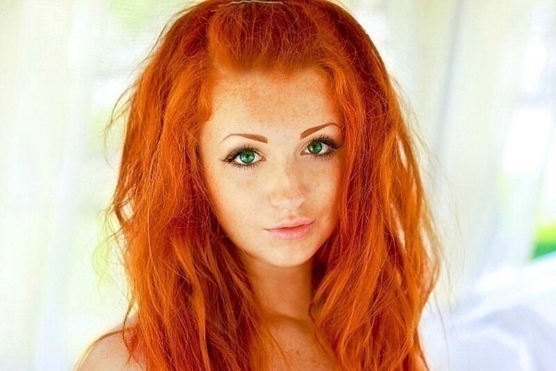 woman with red hair and green eyes