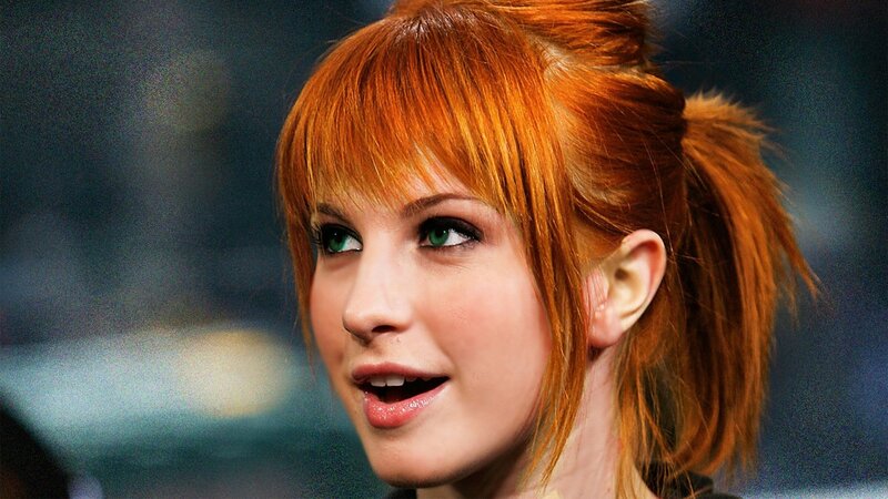 woman with red hair and green eyes