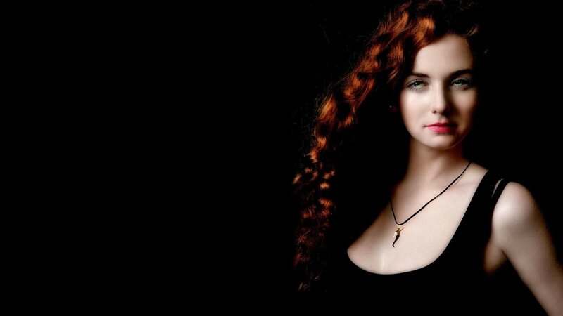 woman with red hair and green eyes