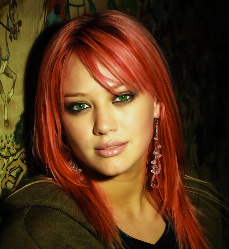 woman with red hair and green eyes