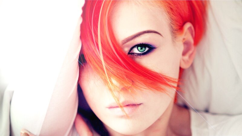 woman with red hair and green eyes