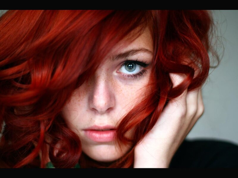 woman with red hair and green eyes