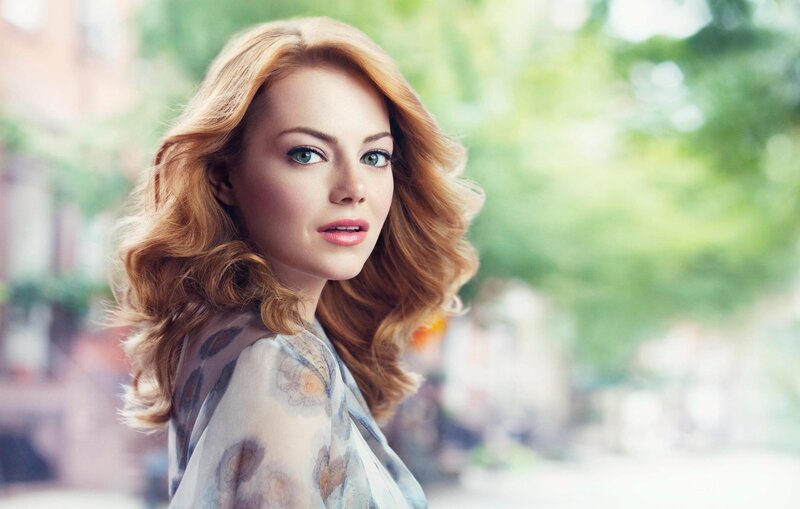 woman with red hair and green eyes